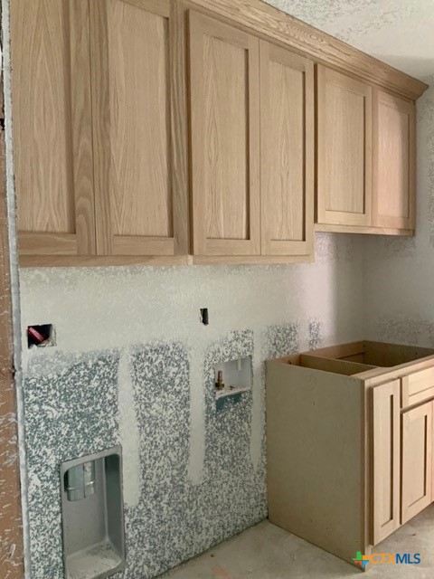 1424 Four Sixes Ranch Road Salado, TX 76571 - Photo 7 of 14 a kitchen with stainless steel appliances granite countertop a granite counter tops and a white cabinets