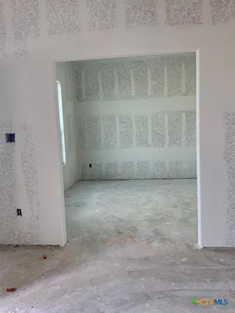 an empty room with a bench