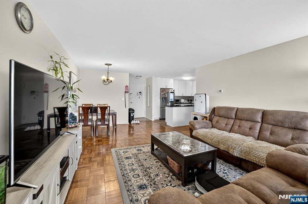 2100 Linwood Avenue, Unit 17U Fort Lee, NJ 07024 - Photo 12 of 23 a living room with furniture kitchen view and a large window