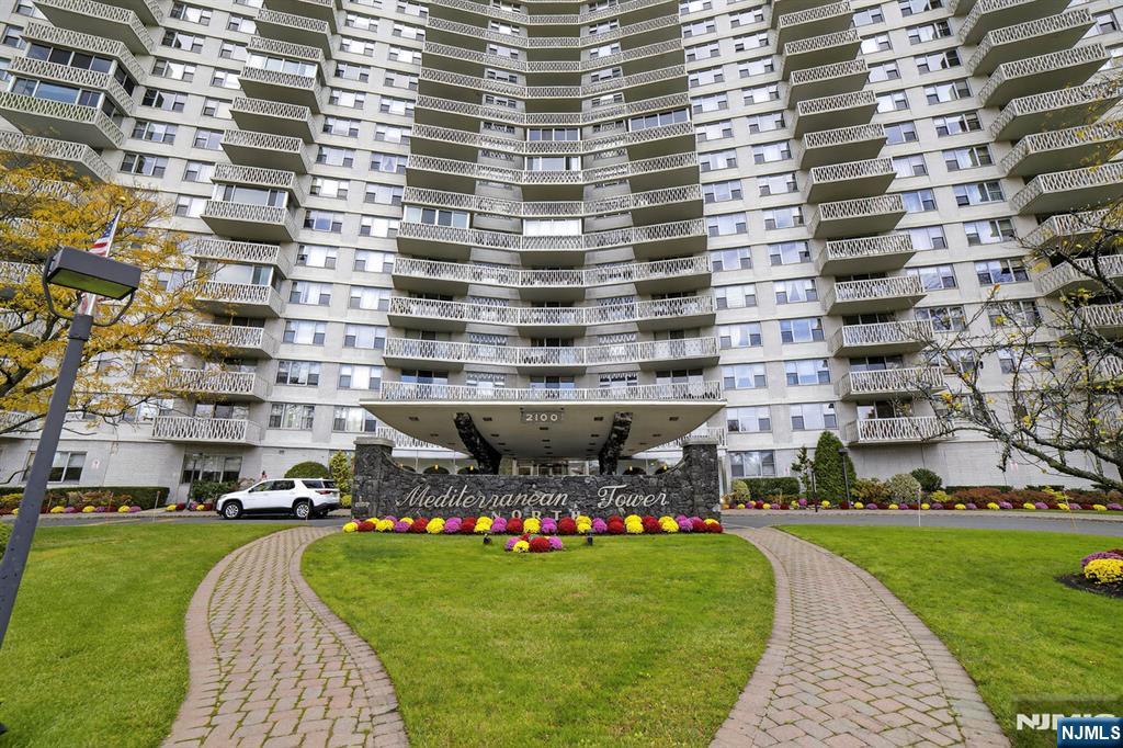 2100 Linwood Avenue, Unit 17U Fort Lee, NJ 07024 - Photo 3 of 23 a aerial view of a building and yard with green space