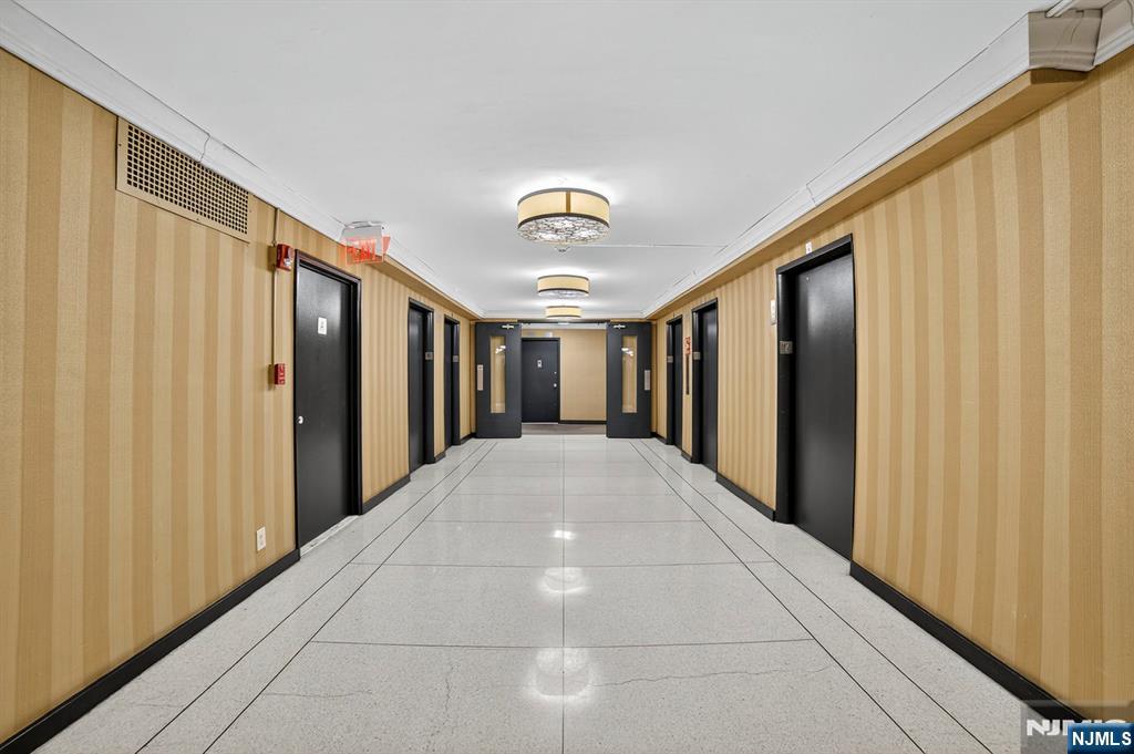 2100 Linwood Avenue, Unit 17U Fort Lee, NJ 07024 - Photo 4 of 23 a view of a hallway with closet and entryway