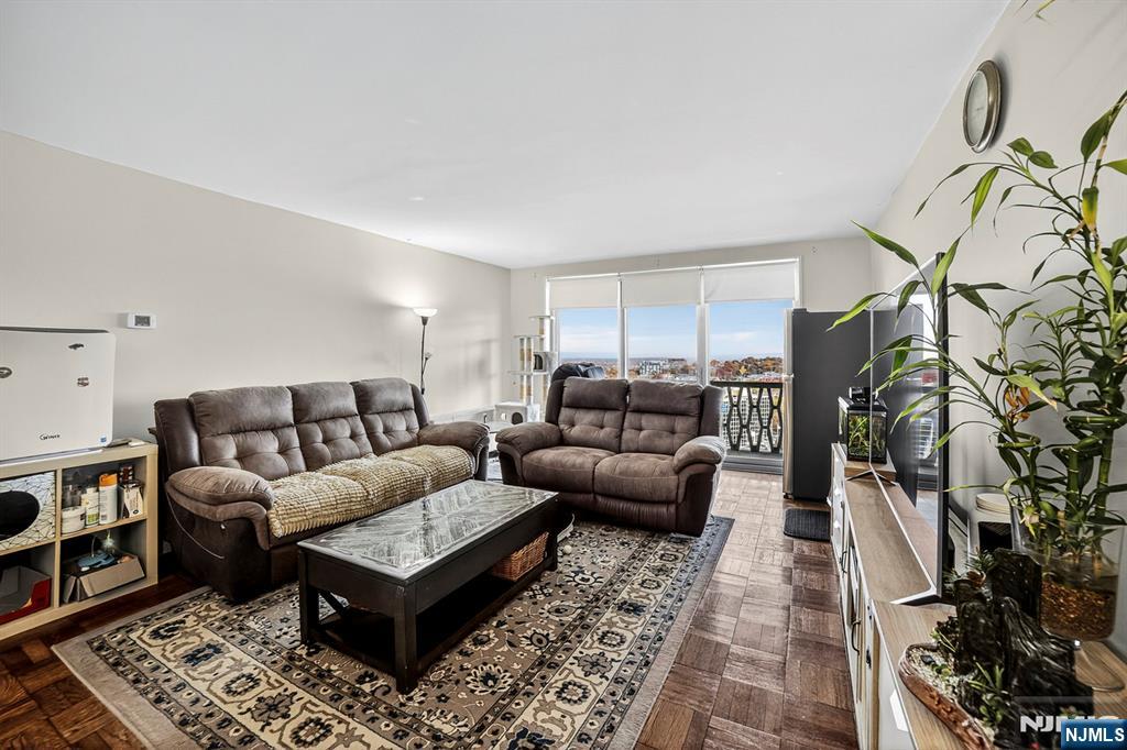 2100 Linwood Avenue, Unit 17U Fort Lee, NJ 07024 - Photo 10 of 23 a living room with furniture and a rug