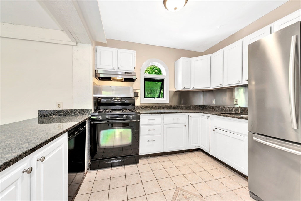 531 Main Street Boxford, MA 01921 - Photo 10 of 42 a kitchen with a stove cabinets and a refrigerator
