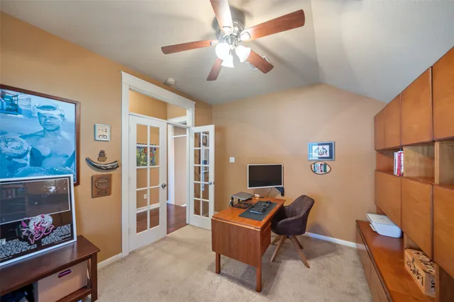 a work room with furniture and a window