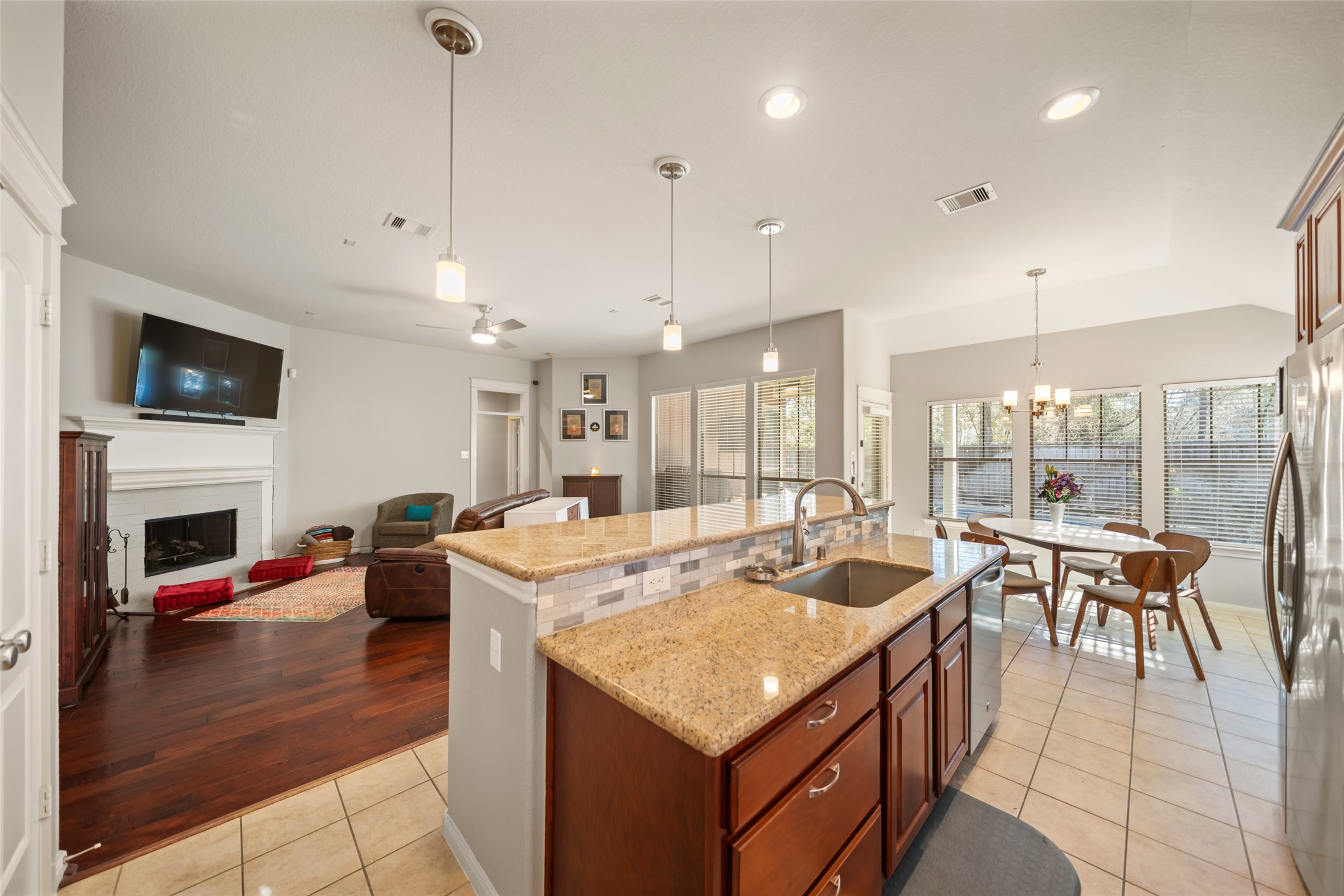 28318 Ryans Ridge Lane Spring, TX 77386 - Photo 18 of 48 a open kitchen with stainless steel appliances granite countertop a lot of counter space dining table and chairs