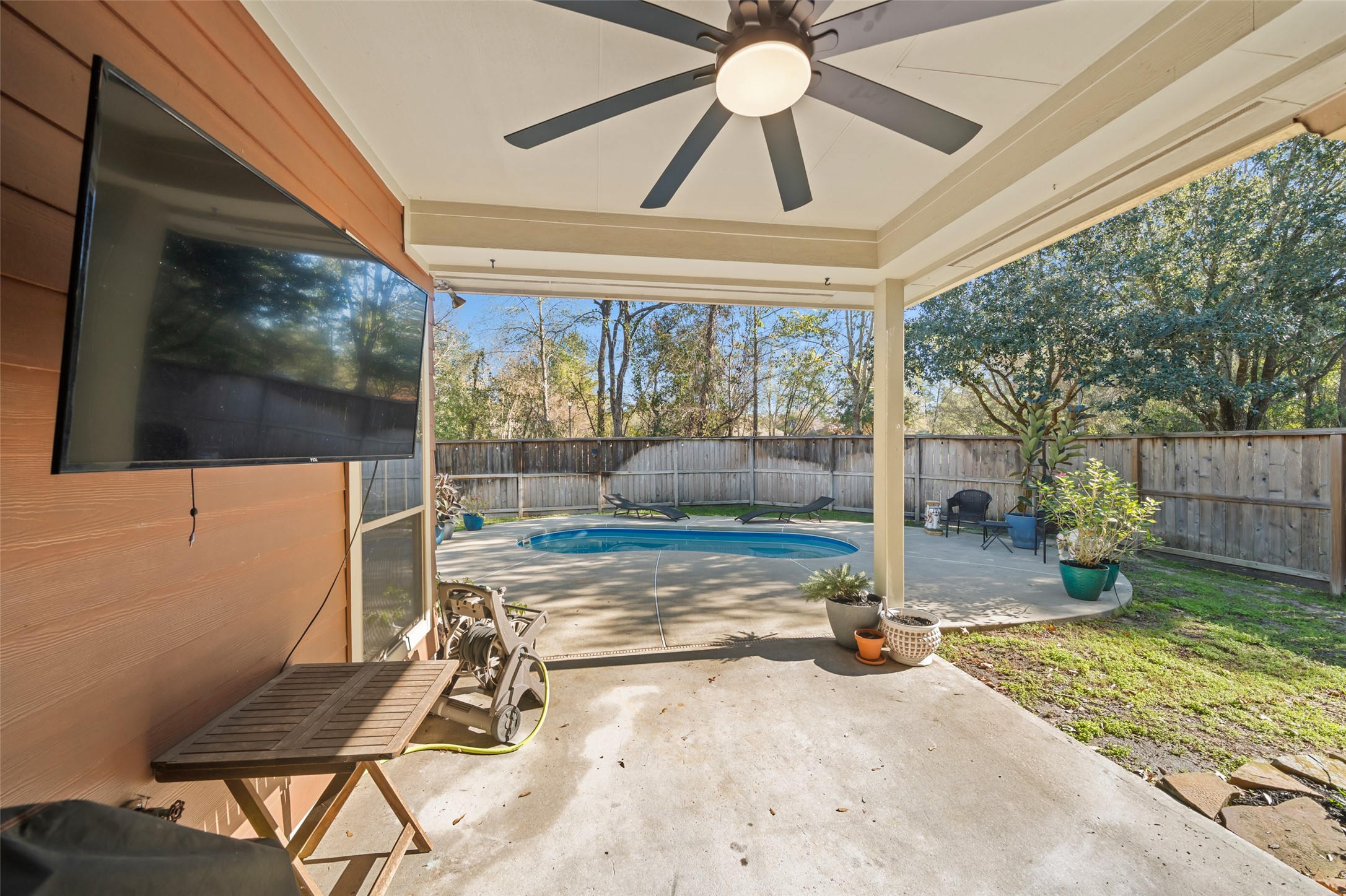 28318 Ryans Ridge Lane Spring, TX 77386 - Photo 34 of 48 a view of a porch with a table and chairs