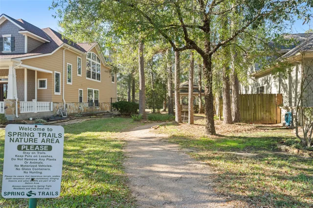 a view of a porch with a table and chairs