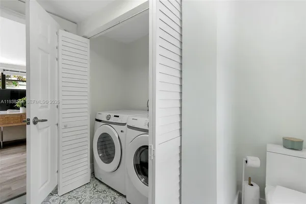 a utility room with dryer and washer