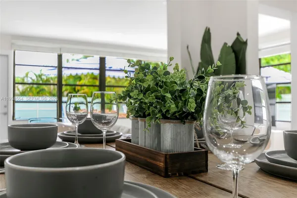 a living room filled with furniture and a potted plant