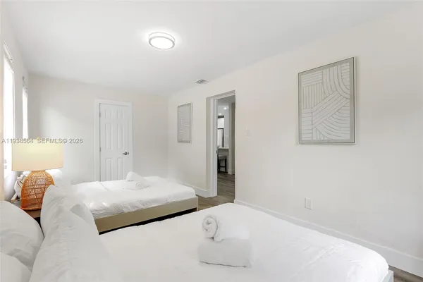 a bedroom with a bed and a couch