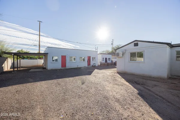 a front view of a house with a road