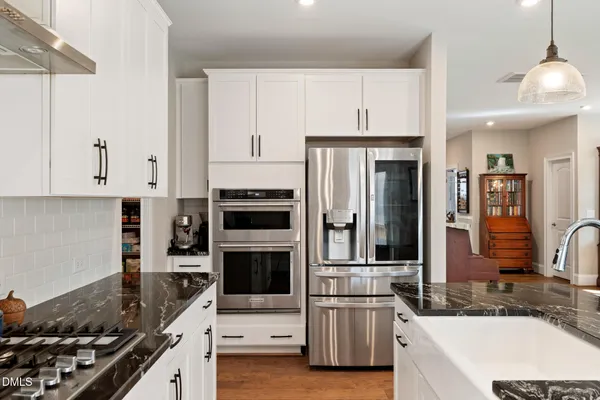 a bathroom with a double vanity sink a and a mirror
