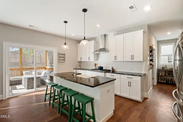 a living room with furniture and a book shelf