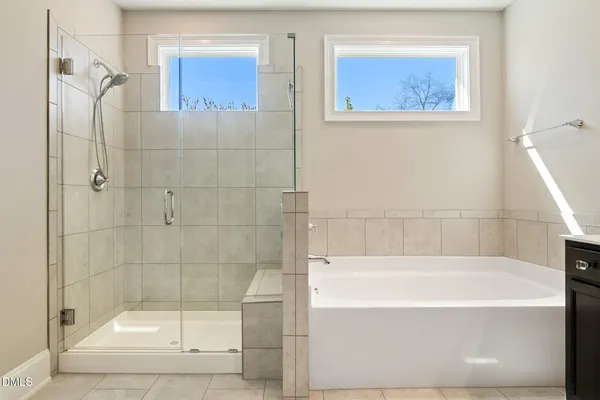 a bathroom with a bathtub and a sink