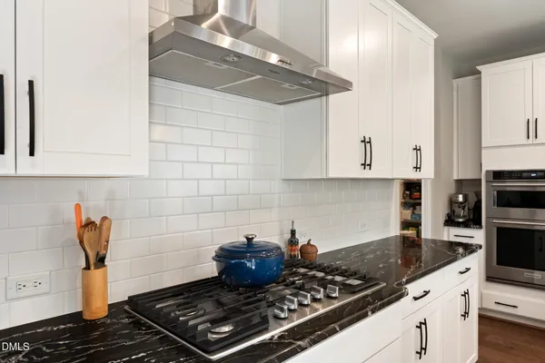 a bedroom with a bed and a desk