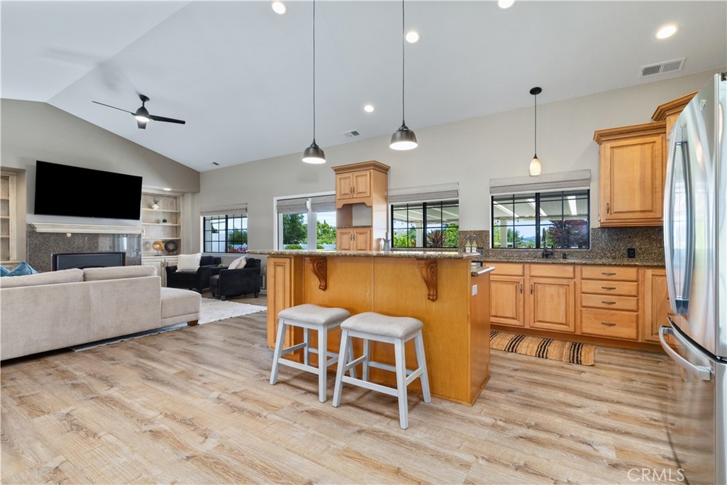 1275 Shane Lane Templeton, CA 93465 - Photo 11 of 70 a living room with furniture a flat screen tv and kitchen view