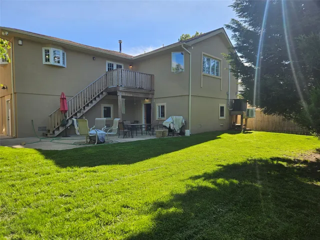 a view of a swimming pool and lounge chairs