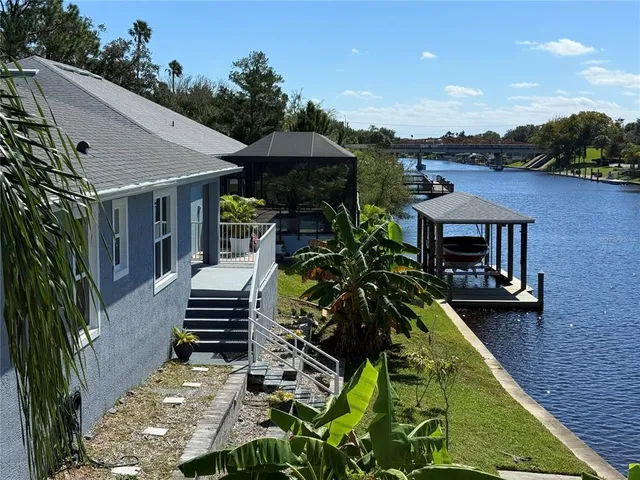 an empty room with wooden door and furniture