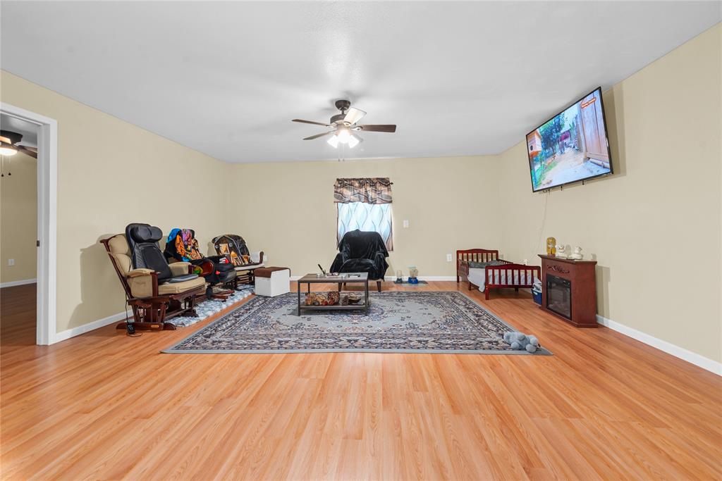 447 Masthead Road Gun Barrel City, TX 75156 - Photo 22 of 27 a living room with furniture and a wooden floor