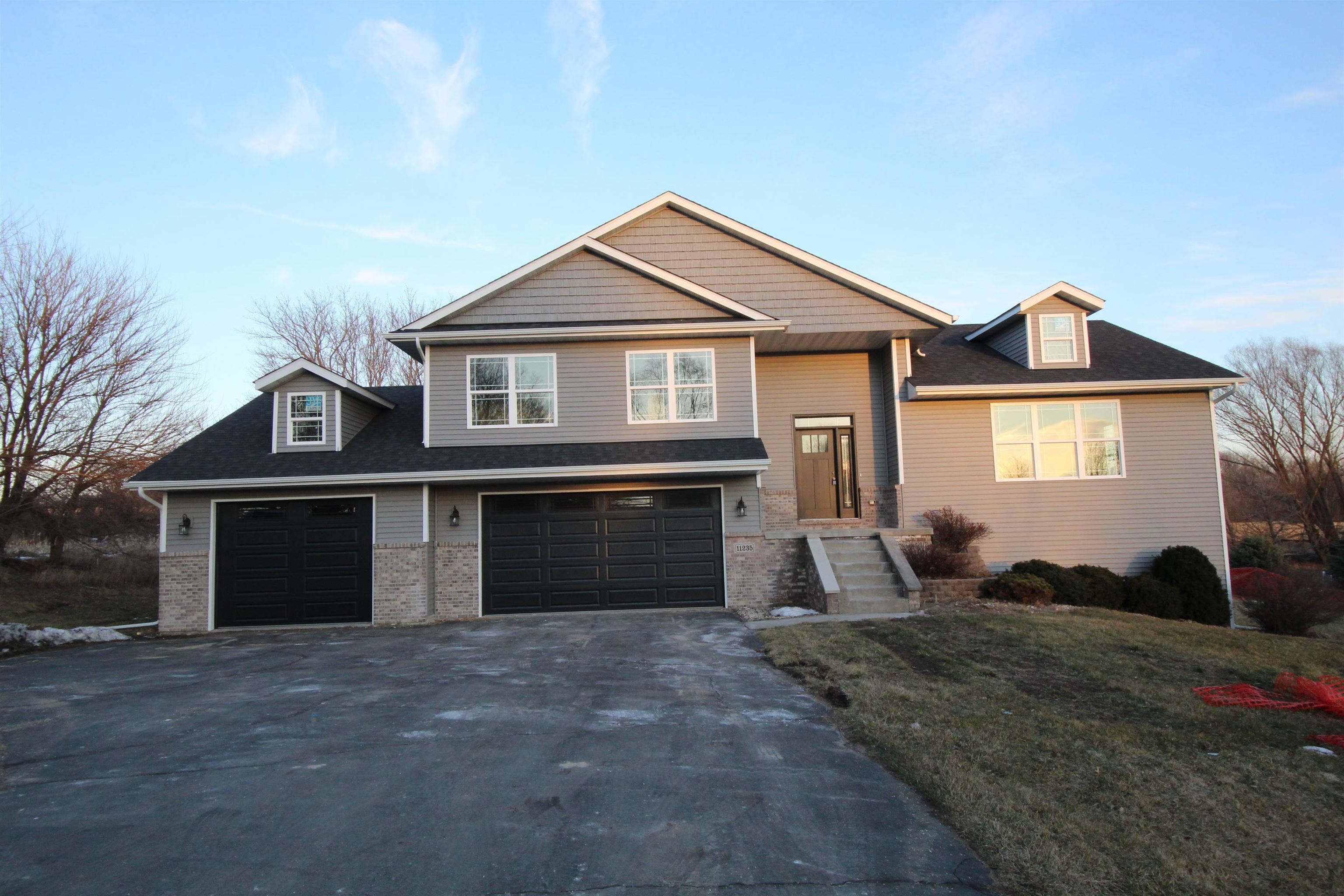 a front view of a house with a yard