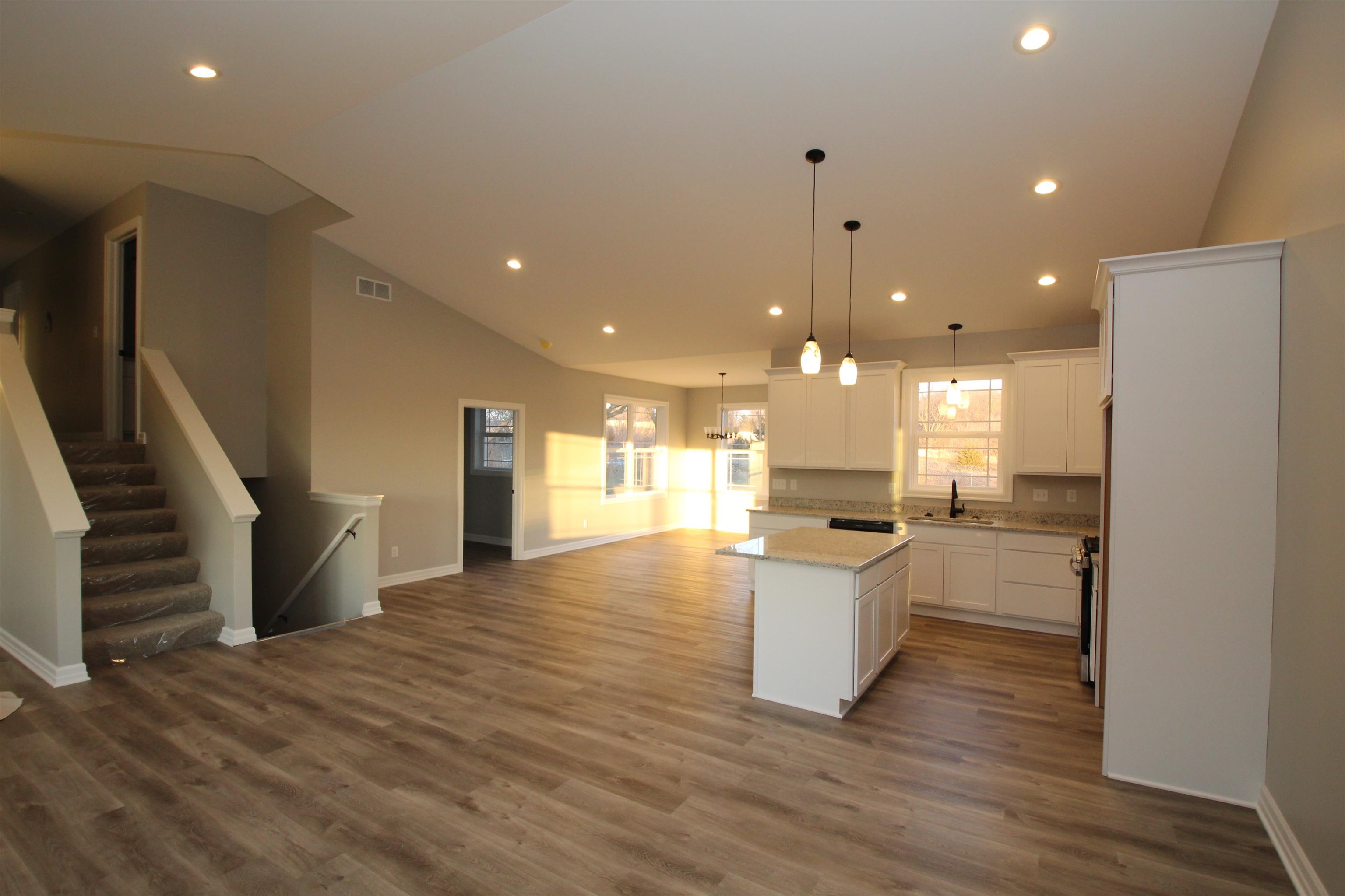 11235 Dublin Drive Roscoe, IL 61073 - Photo 5 of 20 a view of a kitchen with cabinets and wooden floor