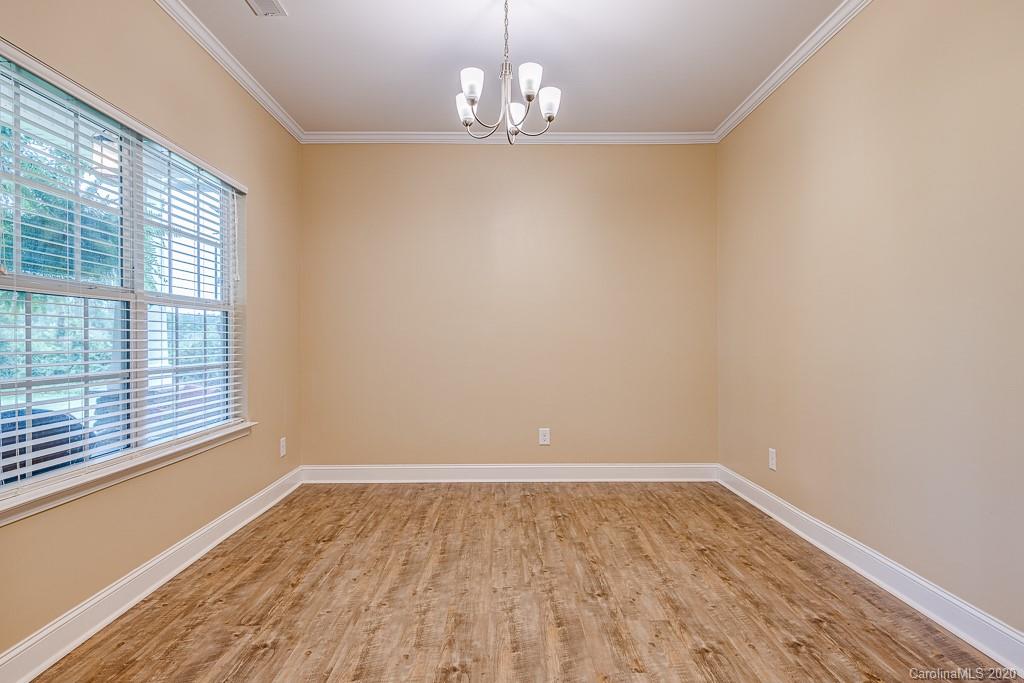 2510 Fletcher Broome Road Monroe, NC 28112 - Photo 11 of 48 a view of wooden floor and windows in a room