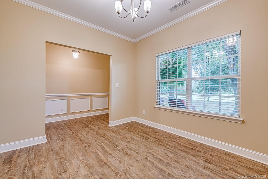 2510 Fletcher Broome Road Monroe, NC 28112 - Photo 12 of 48 a view of an empty room with wooden floor and a window