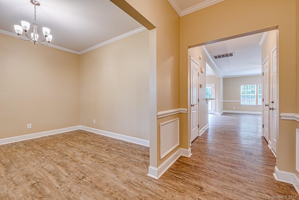 2510 Fletcher Broome Road Monroe, NC 28112 - Photo 13 of 48 a view of a hallway with wooden floor