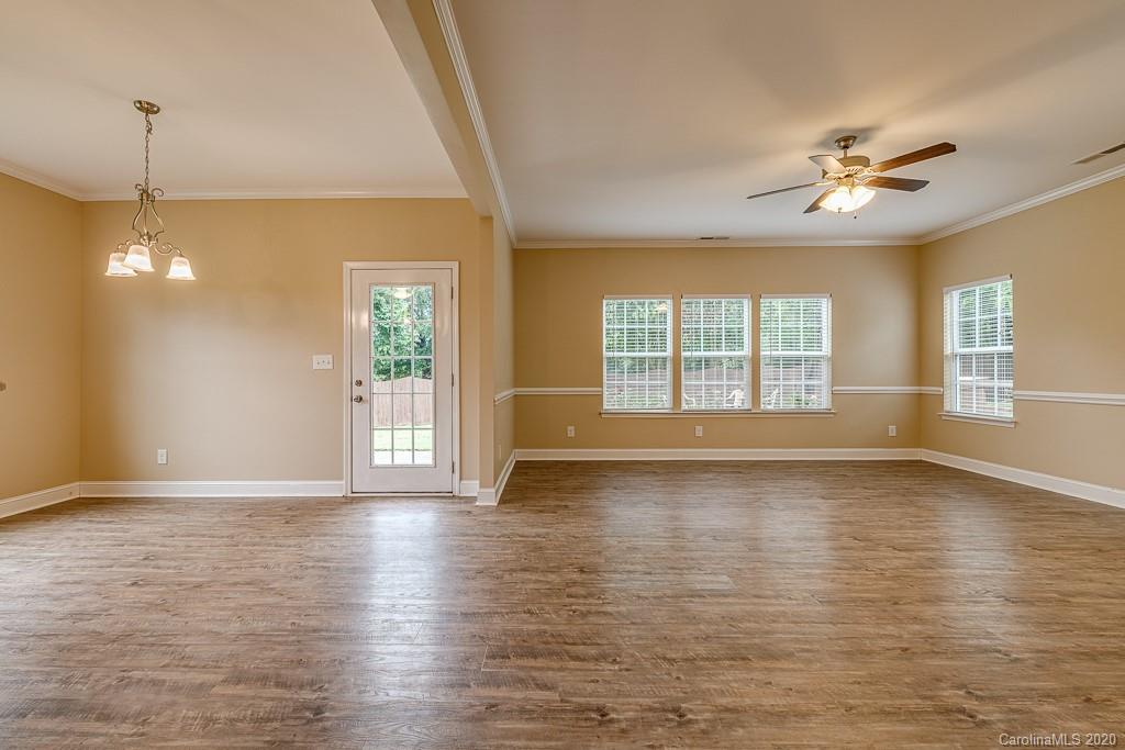 2510 Fletcher Broome Road Monroe, NC 28112 - Photo 14 of 48 a view of an empty room with window and wooden floor