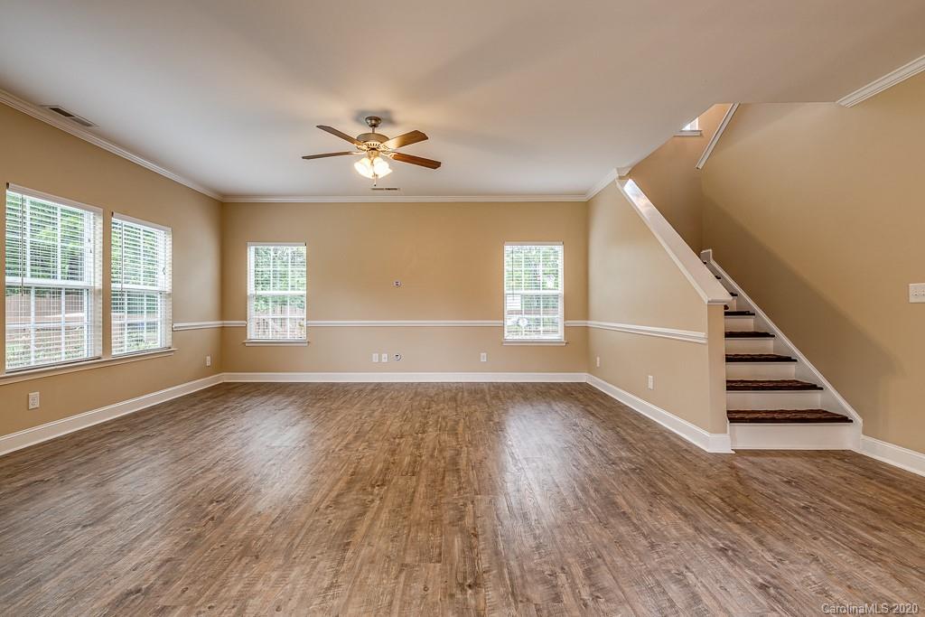 2510 Fletcher Broome Road Monroe, NC 28112 - Photo 16 of 48 a view of an empty room with wooden floor and a window