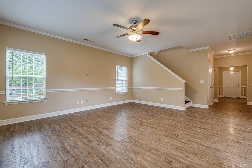 2510 Fletcher Broome Road Monroe, NC 28112 - Photo 17 of 48 a view of an empty room with wooden floor and a window