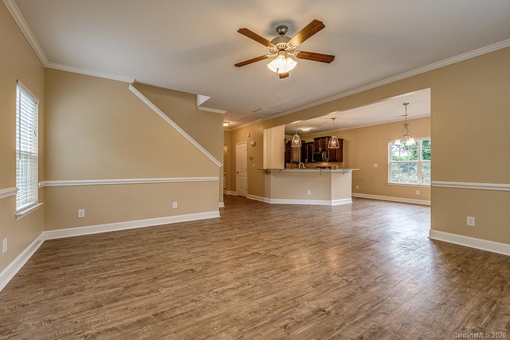 2510 Fletcher Broome Road Monroe, NC 28112 - Photo 19 of 48 an empty room with wooden floor and windows