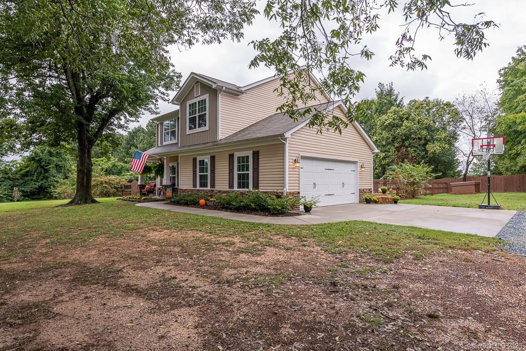 2510 Fletcher Broome Road Monroe, NC 28112 - Photo 3 of 48 a front view of a house with a yard and trees