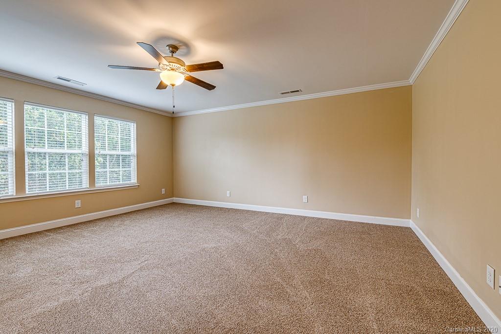 2510 Fletcher Broome Road Monroe, NC 28112 - Photo 31 of 48 an empty room with windows and fan