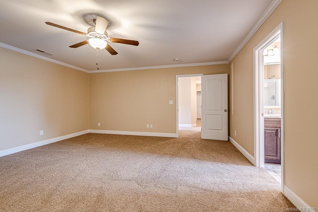 2510 Fletcher Broome Road Monroe, NC 28112 - Photo 33 of 48 an empty room with a ceiling fan and window