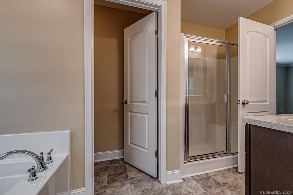 2510 Fletcher Broome Road Monroe, NC 28112 - Photo 35 of 48 a bathroom with a granite countertop sink and shower