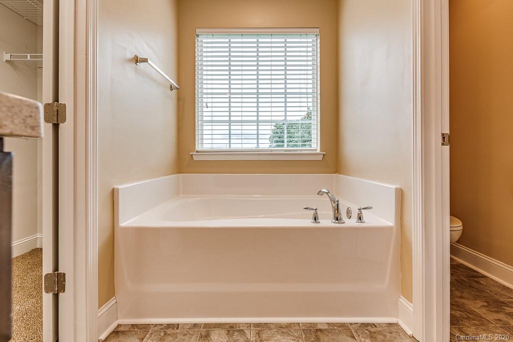 2510 Fletcher Broome Road Monroe, NC 28112 - Photo 36 of 48 a bathroom with bathtub and window