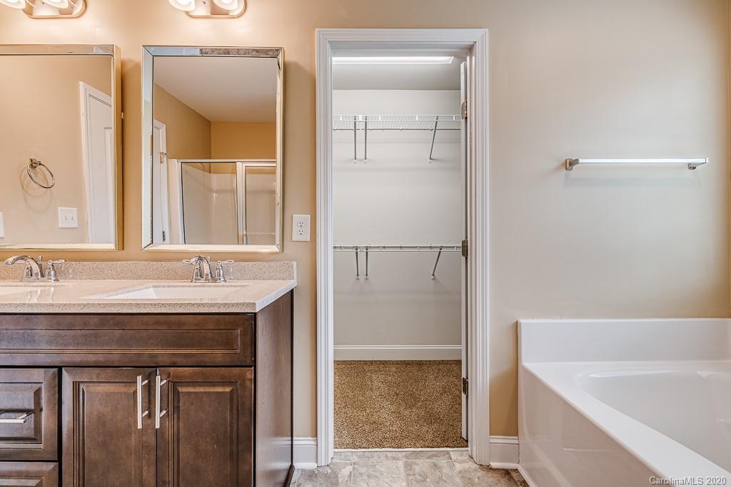 2510 Fletcher Broome Road Monroe, NC 28112 - Photo 37 of 48 a bathroom with a sink and a mirror