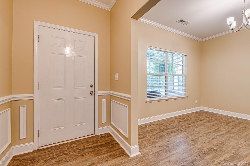 2510 Fletcher Broome Road Monroe, NC 28112 - Photo 10 of 48 a view of an empty room with wooden floor and a window