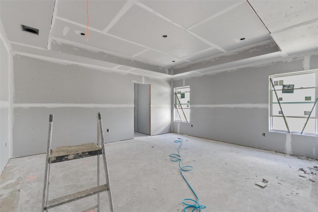 1405 Red Rock Road Hewitt, TX 76643 - Photo 14 of 20 Tray ceiling detail, multiple window openings, recessed lighting openings, and unfinished drywall walls
