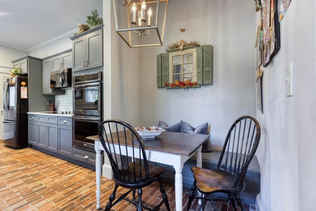 304 Edwards Street Monroe, GA 30655 - Photo 14 of 64 a view of a dining room with furniture
