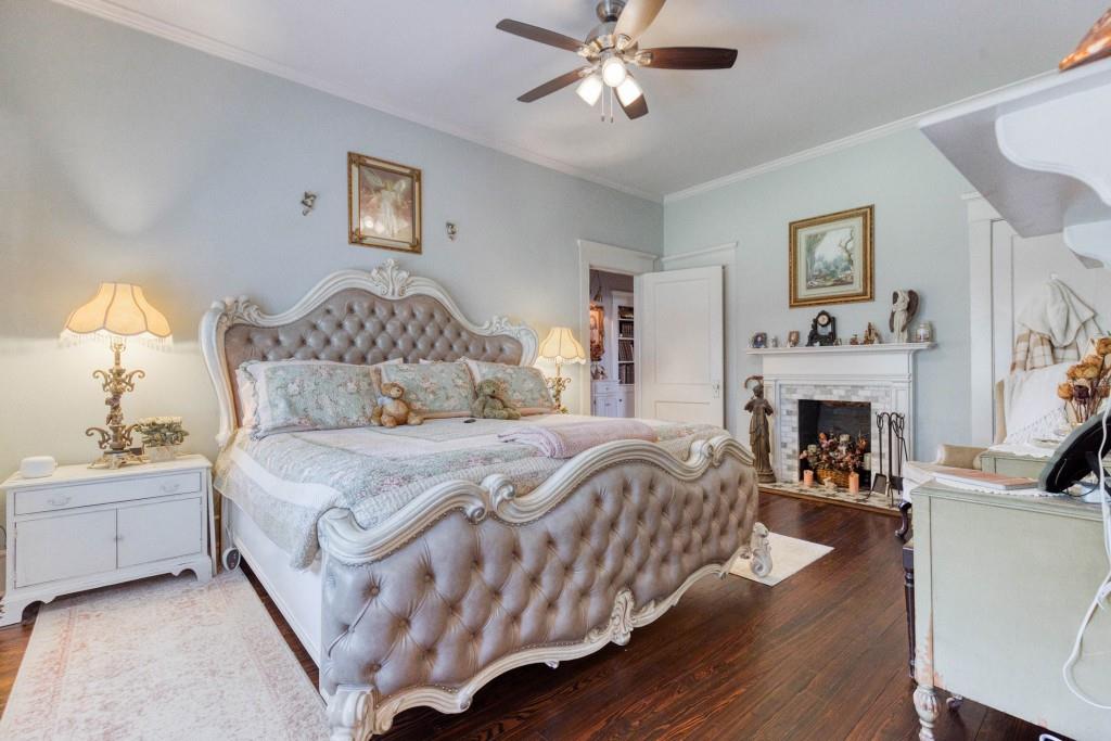 304 Edwards Street Monroe, GA 30655 - Photo 19 of 64 a bedroom with a bed and a fireplace