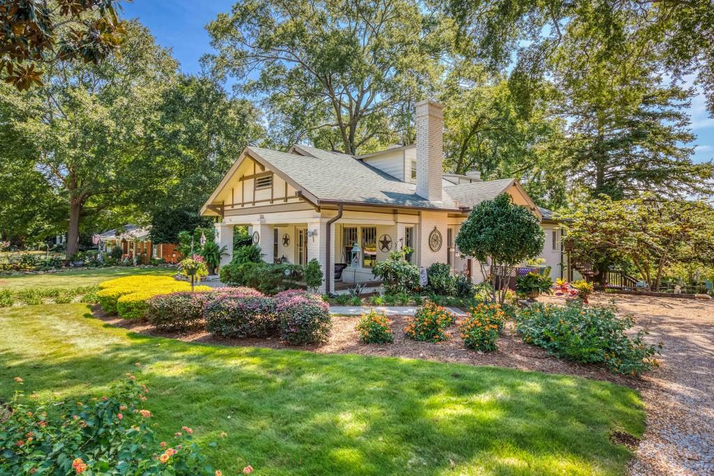 304 Edwards Street Monroe, GA 30655 - Photo 2 of 64 a front view of a house with swimming pool having outdoor seating