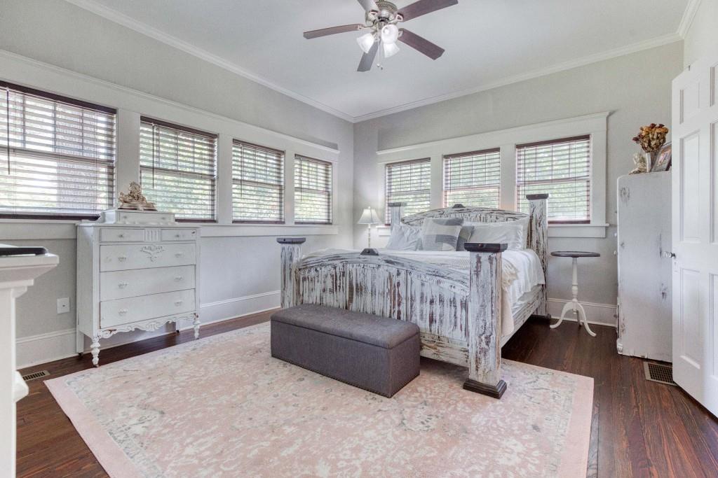 304 Edwards Street Monroe, GA 30655 - Photo 25 of 64 a spacious bedroom with a bed and a dresser