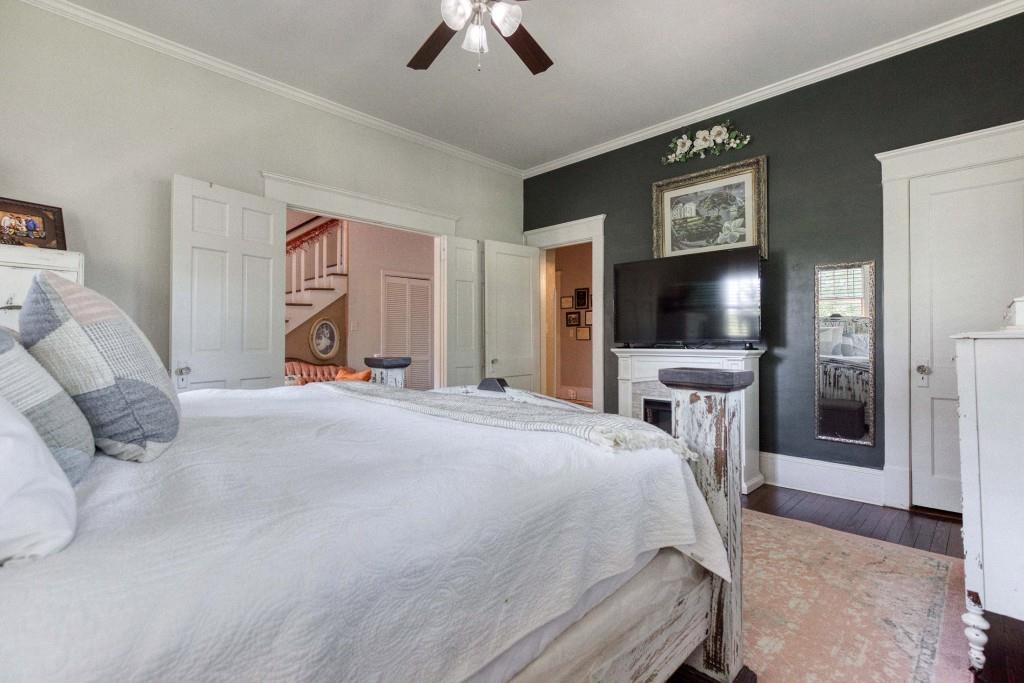 304 Edwards Street Monroe, GA 30655 - Photo 26 of 64 a bedroom with a bed and a flat screen tv