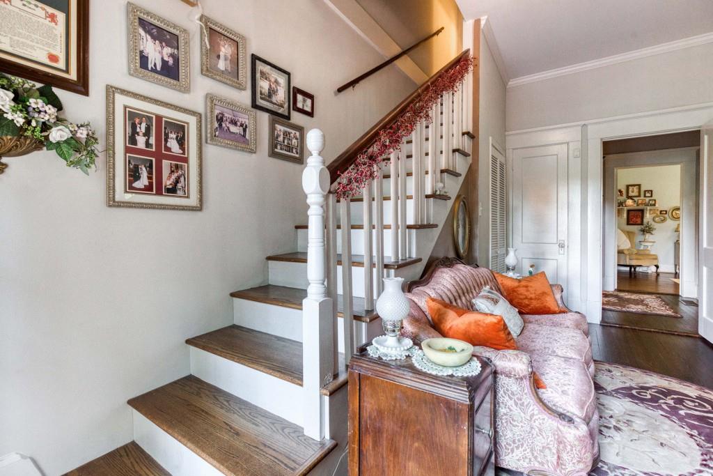 304 Edwards Street Monroe, GA 30655 - Photo 29 of 64 a room with lots of white furniture and wooden floor