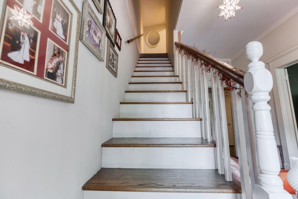 304 Edwards Street Monroe, GA 30655 - Photo 30 of 64 a view of staircase with white walls