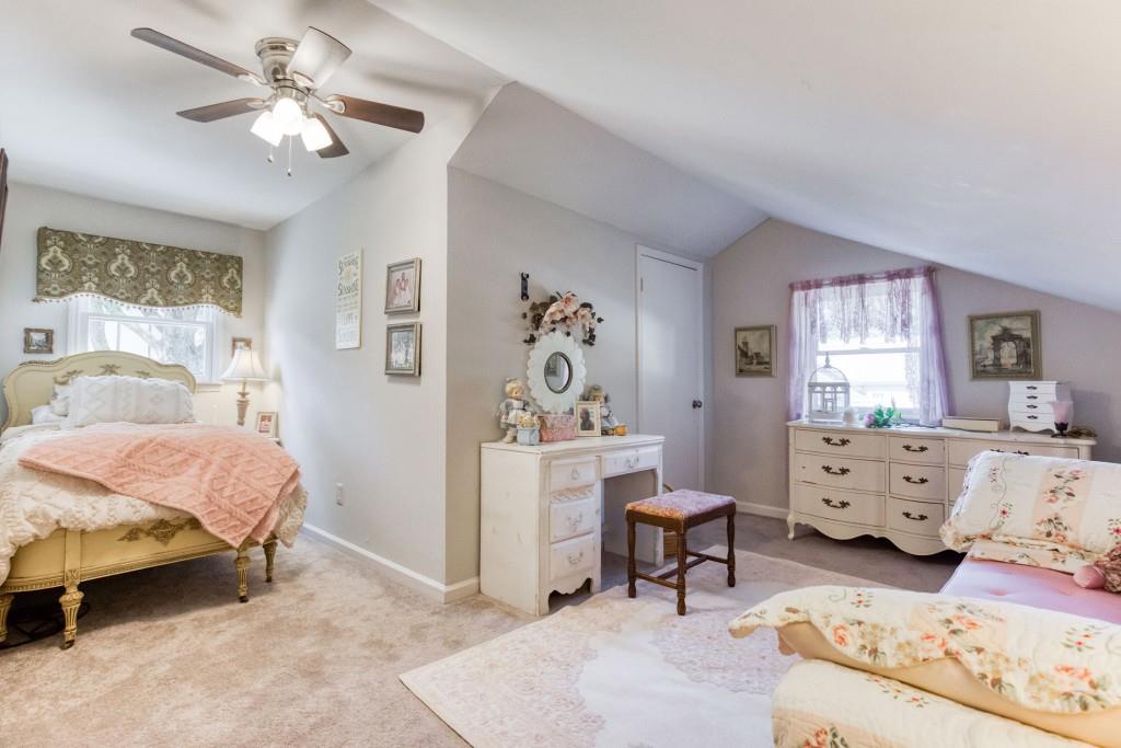 304 Edwards Street Monroe, GA 30655 - Photo 35 of 64 a bedroom with furniture and a large window