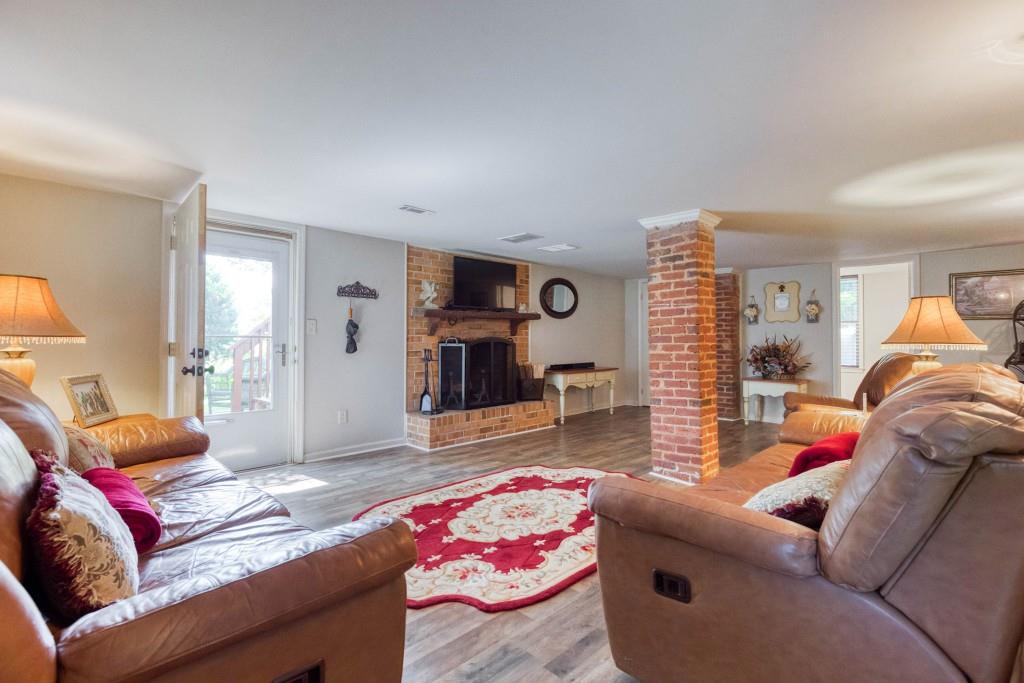 304 Edwards Street Monroe, GA 30655 - Photo 38 of 64 a living room with furniture and a couch