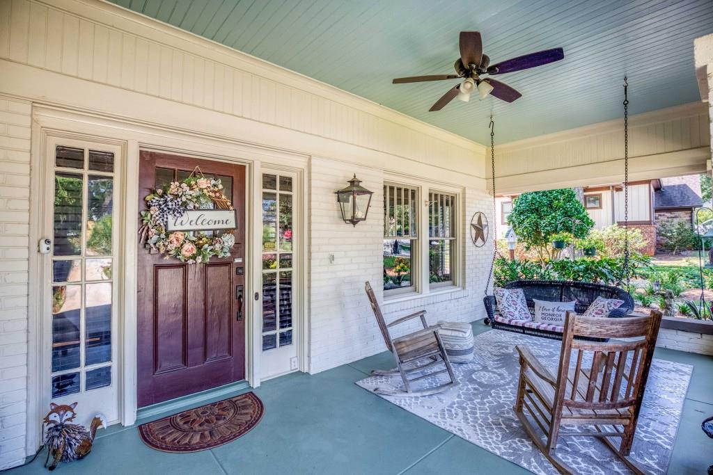 304 Edwards Street Monroe, GA 30655 - Photo 4 of 64 a view of a dining room with furniture window and wooden floor